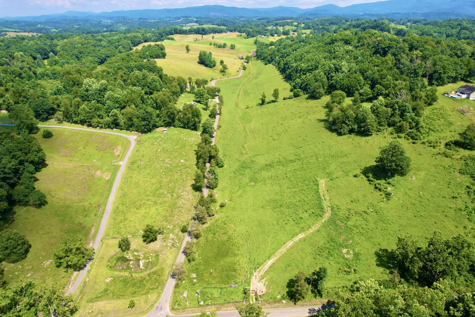 Aerial view of rolling green residential lots on Dillard Road in Chilhowie, Virginia