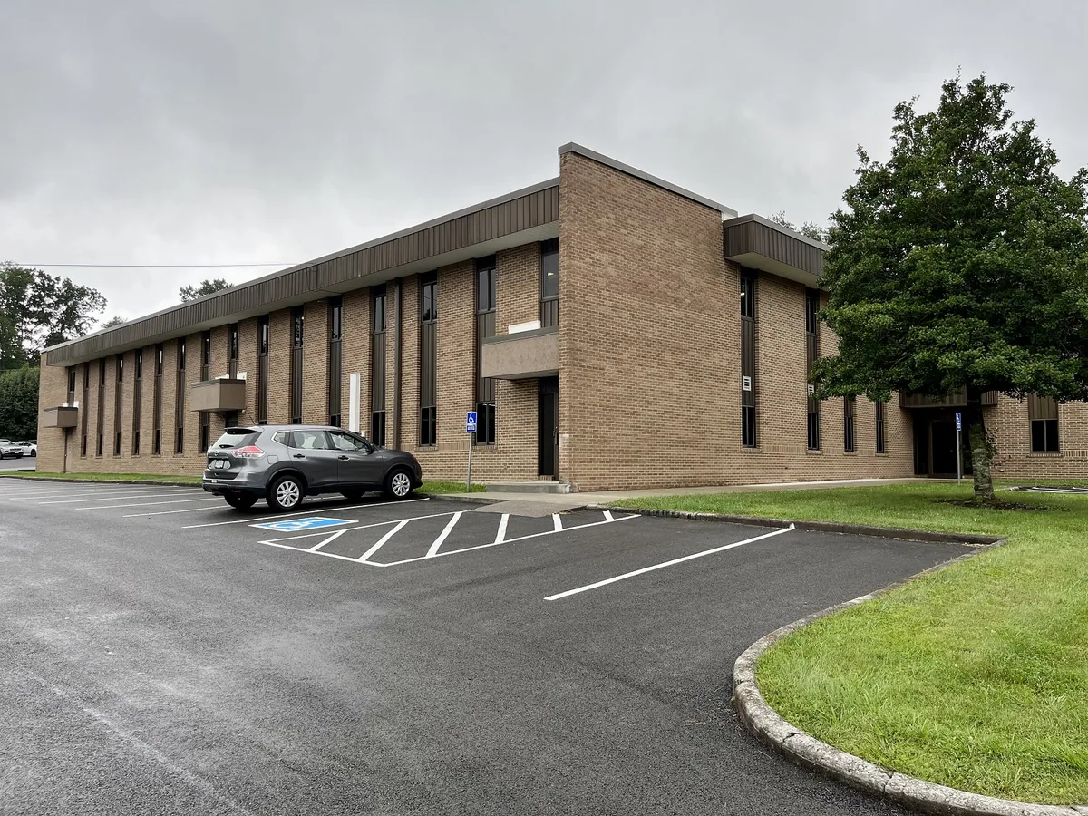 Two-story brick commercial office building with parking on Spring Avenue in Wise, Virginia
